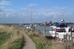 13: A footpath runs along the side of The Harbour to the Bailey Bridge, about a mile inland