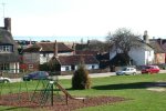 7: A childrens play area centres the Village Green, and the sea can be seen beyond